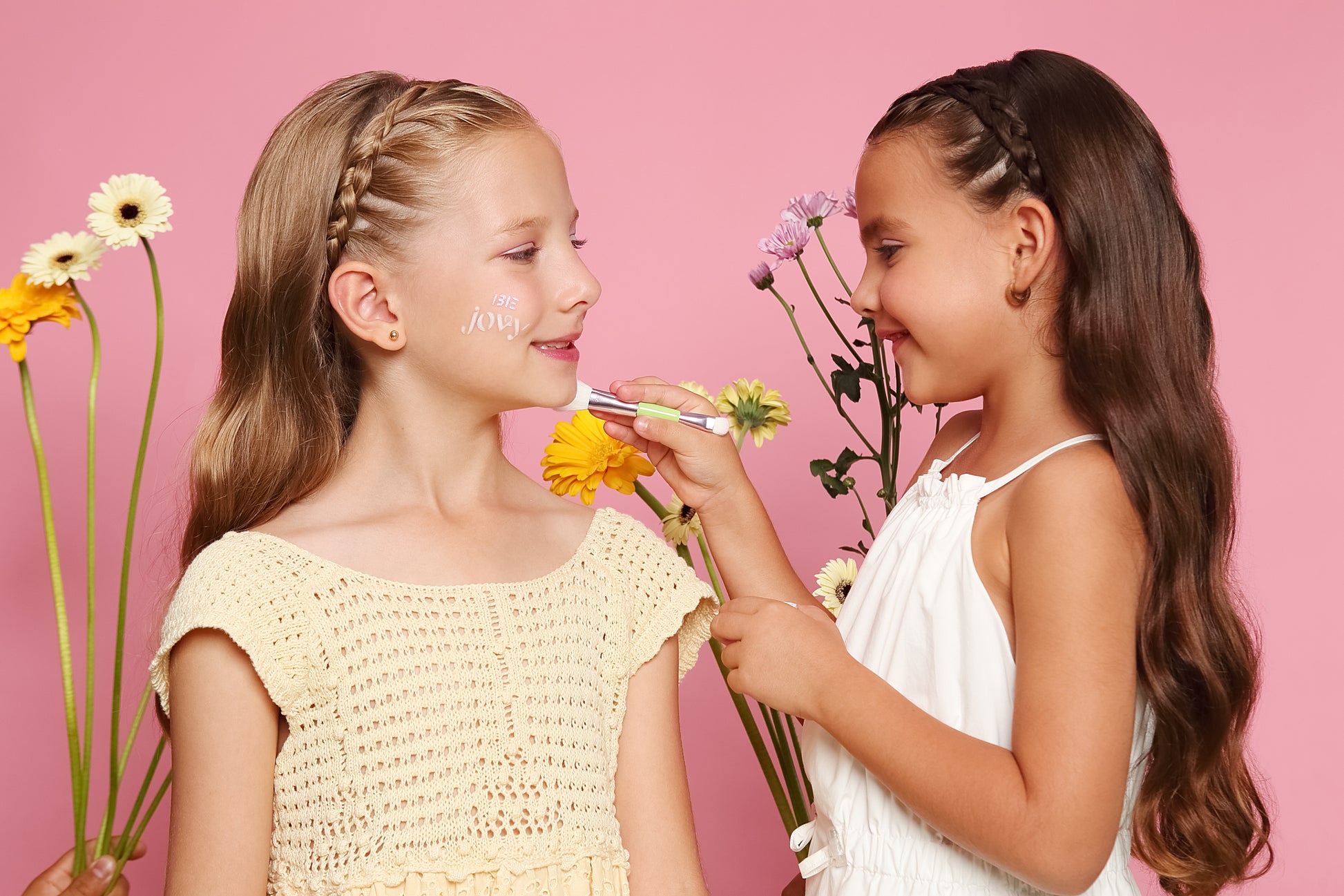 Kids modelling the Plant Based Jovy Makeup Products
