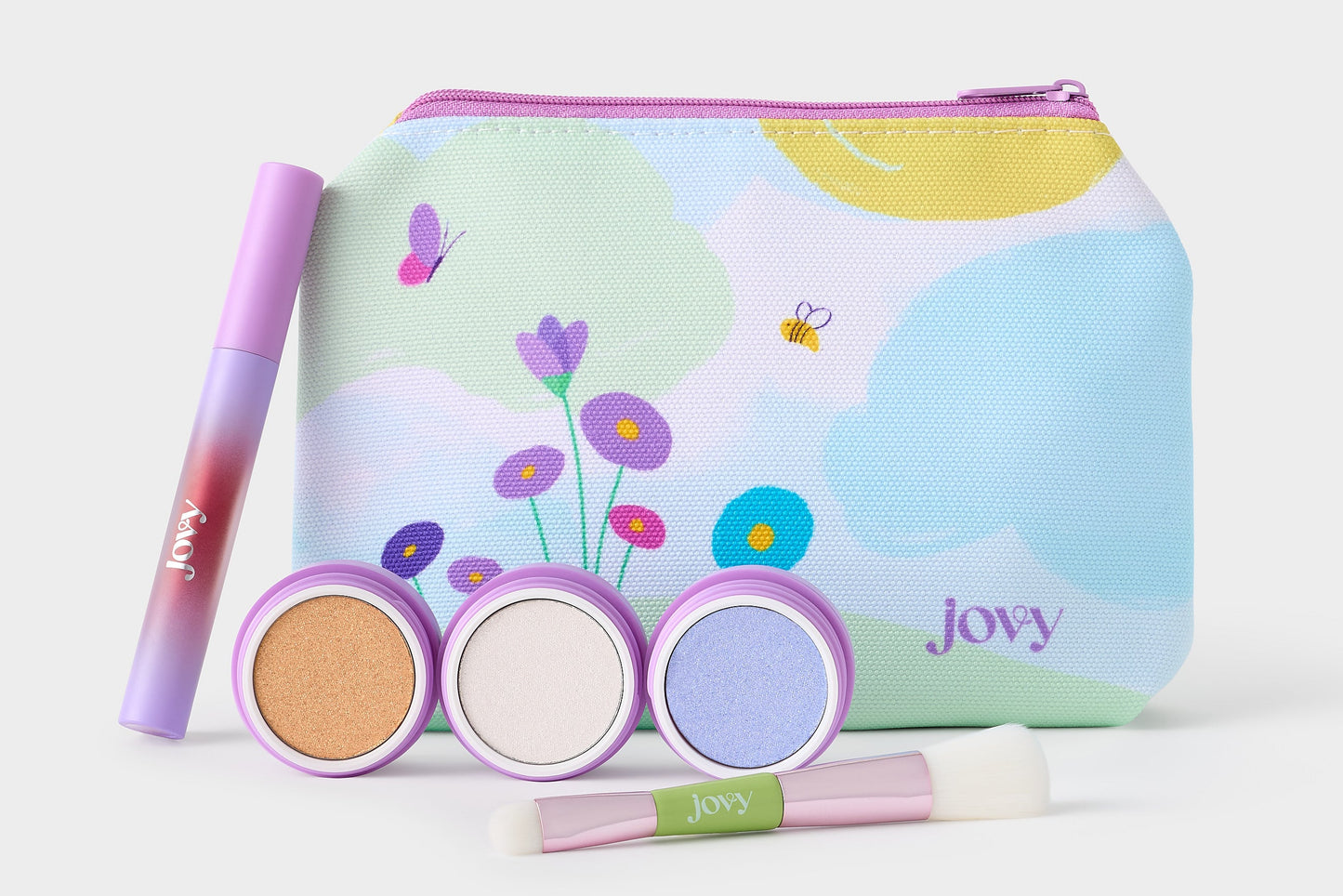 Open Jovy Berry Bliss Play Makeup Kit showing the three dual eyeshadow/blush colors, lip gloss, makeup bag, and duo makeup brush.