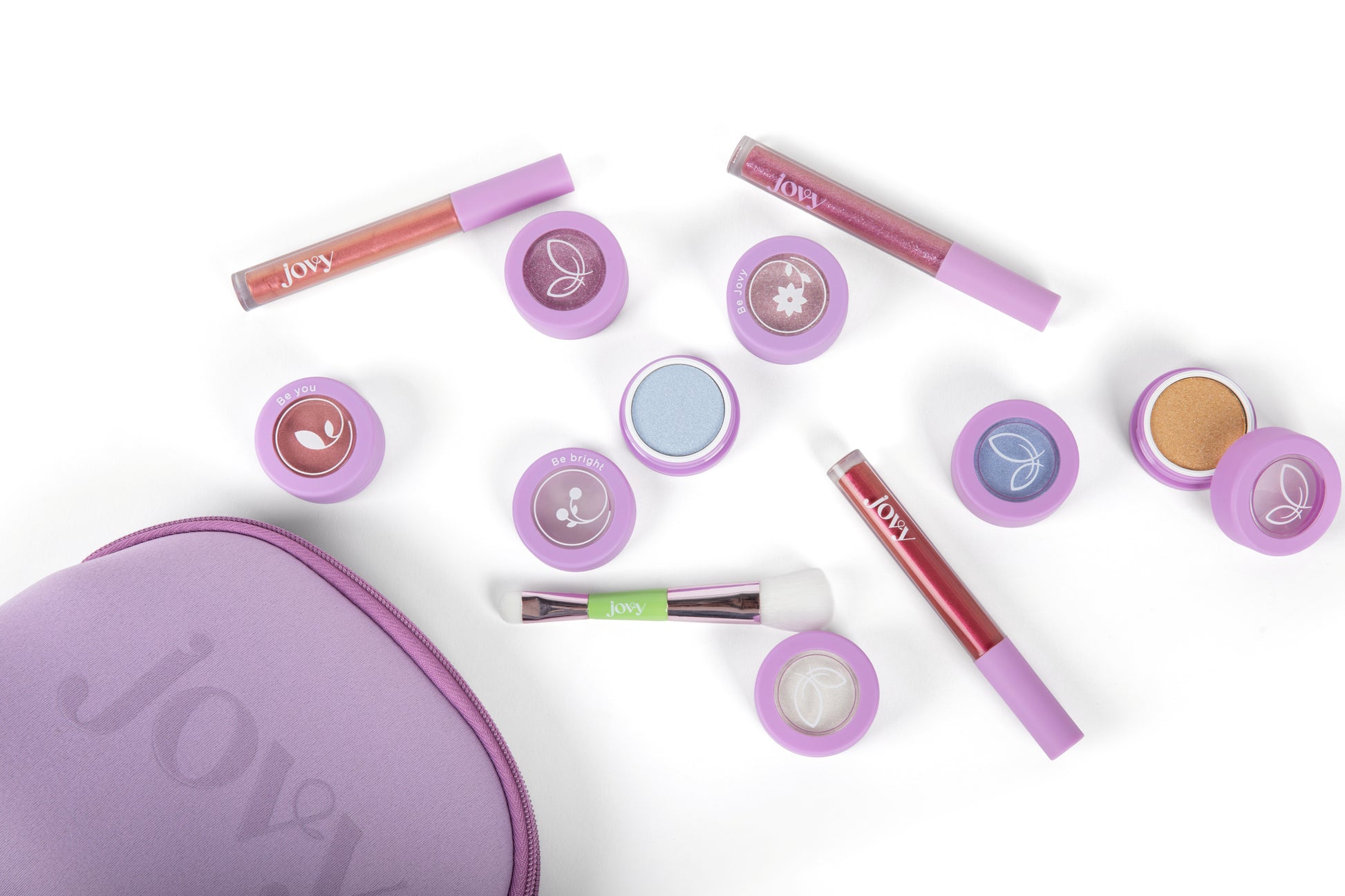 Jovy Glow Up Makeup set with three lip glosses, seven eyeshadows and a makeup brush on a white background, with purple makeup bag featuring the brand 'Jovy'.