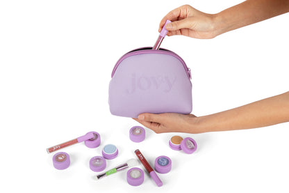 Jovy Glow Up Makeup Set with Purple limited edition bag plus eyeshadows and lip glosses on a white background