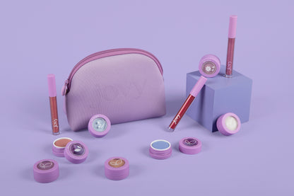 Jovy Glow Up Makeup Set with eyeshadow and lip glosses on a purple background