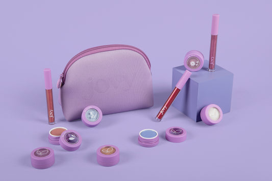 Jovy Glow Up Makeup Set with eyeshadow and lip glosses on a purple background